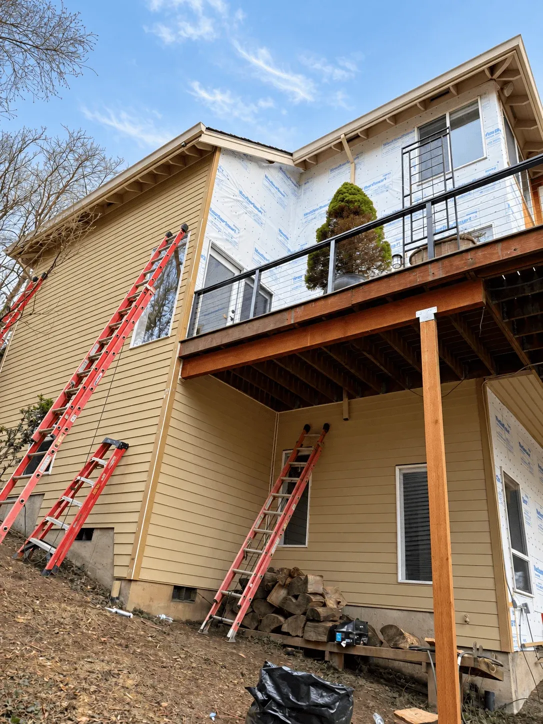 Upper deck and new support posts during an exterior rebuild