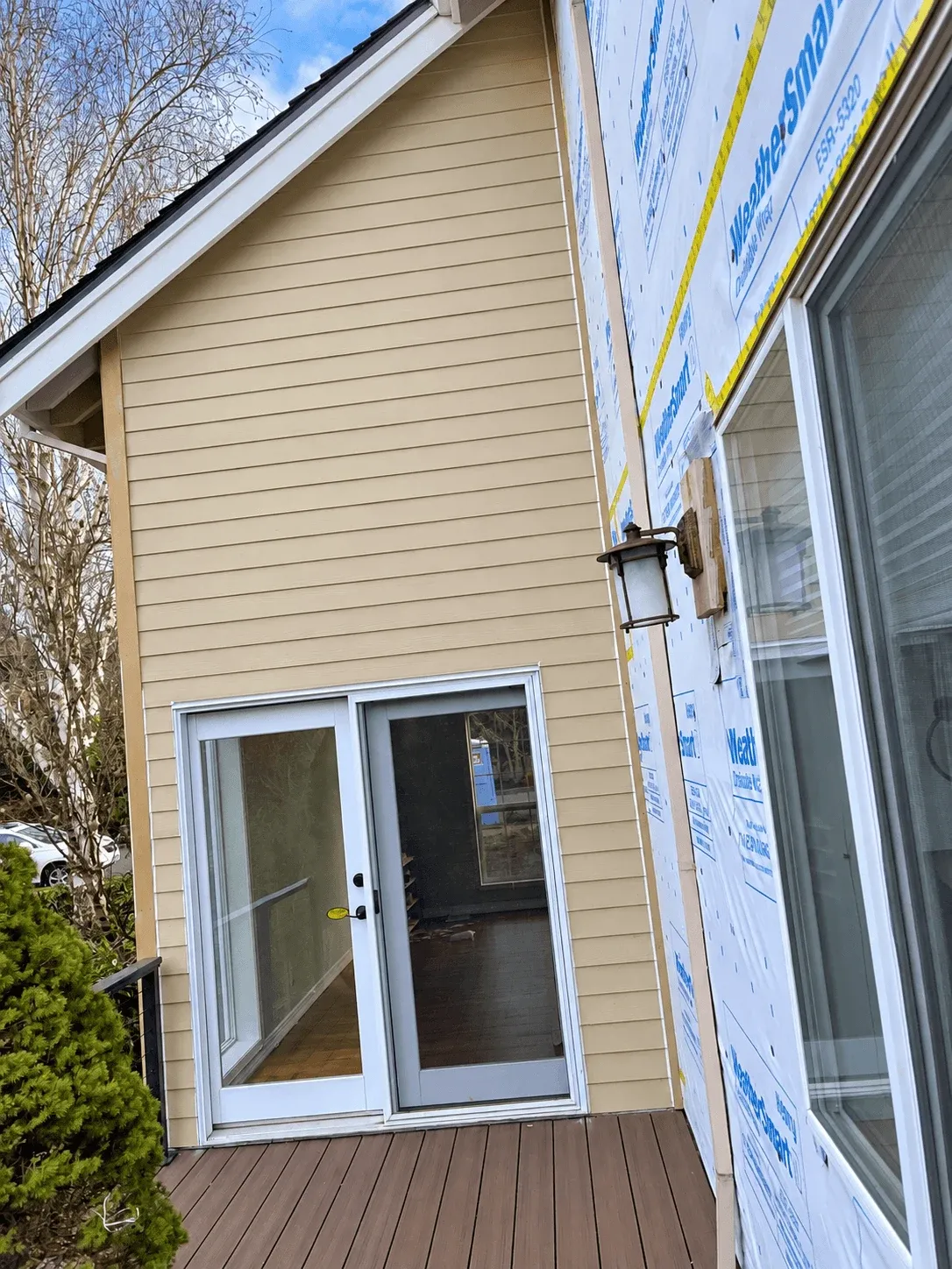Composite deck boards outside new French doors