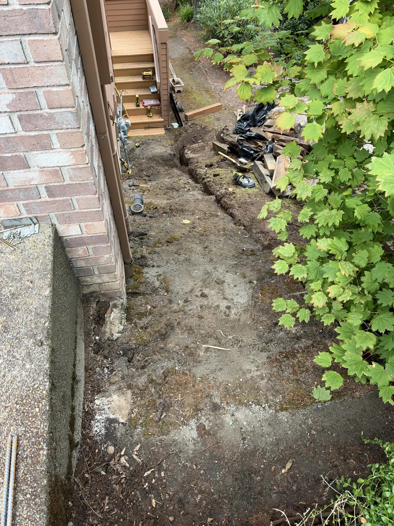 Cleared ground before the outdoor staircase rebuild