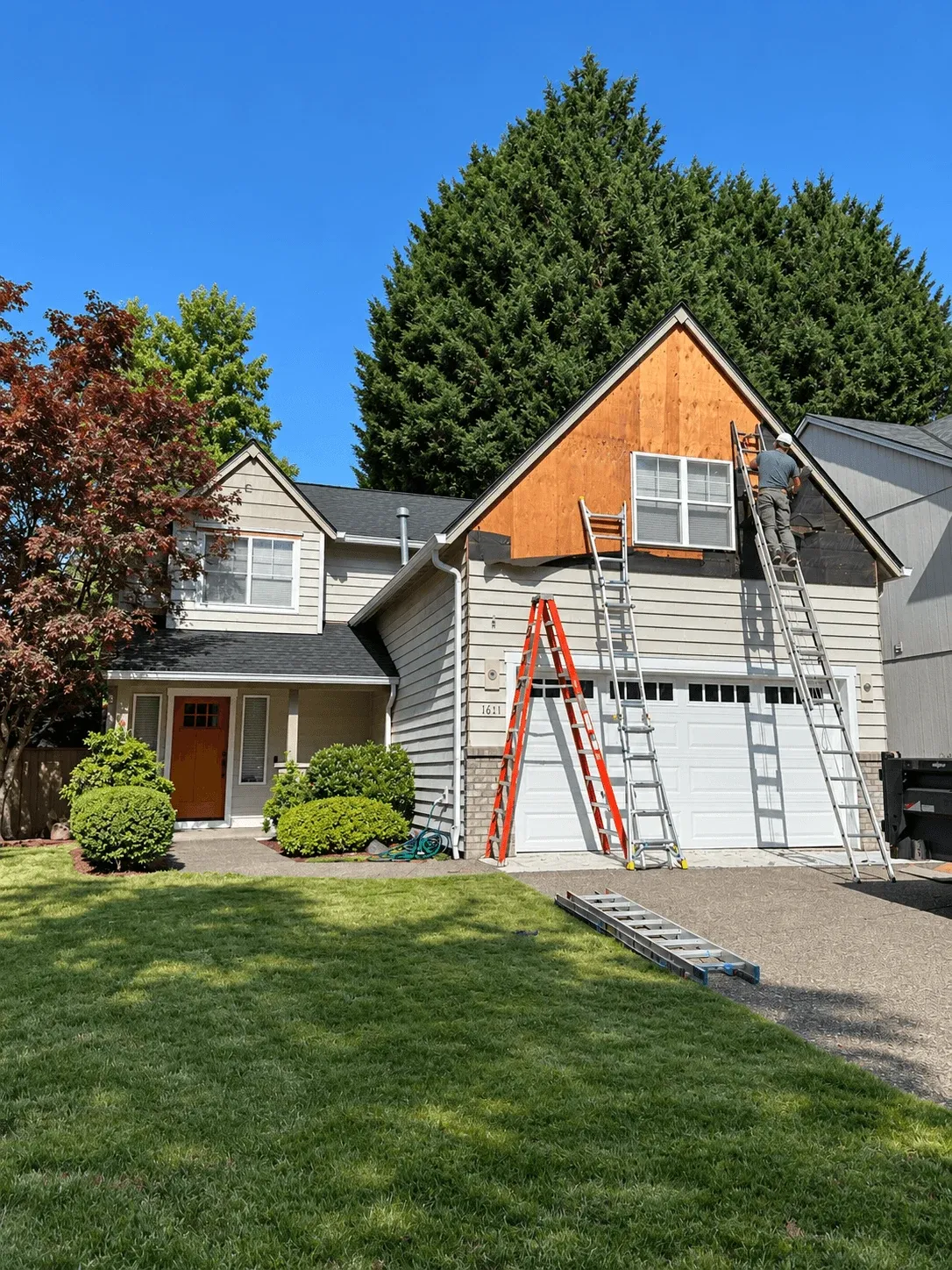 Garage gable stripped to the sheathing during siding replacement
