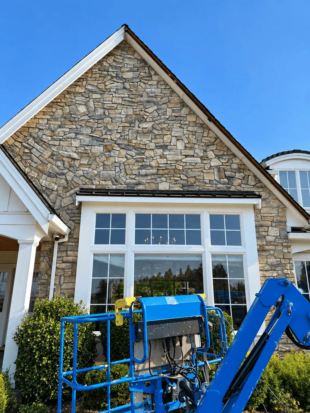 Lift in place during stone gable and window trim work